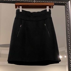 Ann Taylor Loft elastic waist knit skirt with brass tone zip pockets.